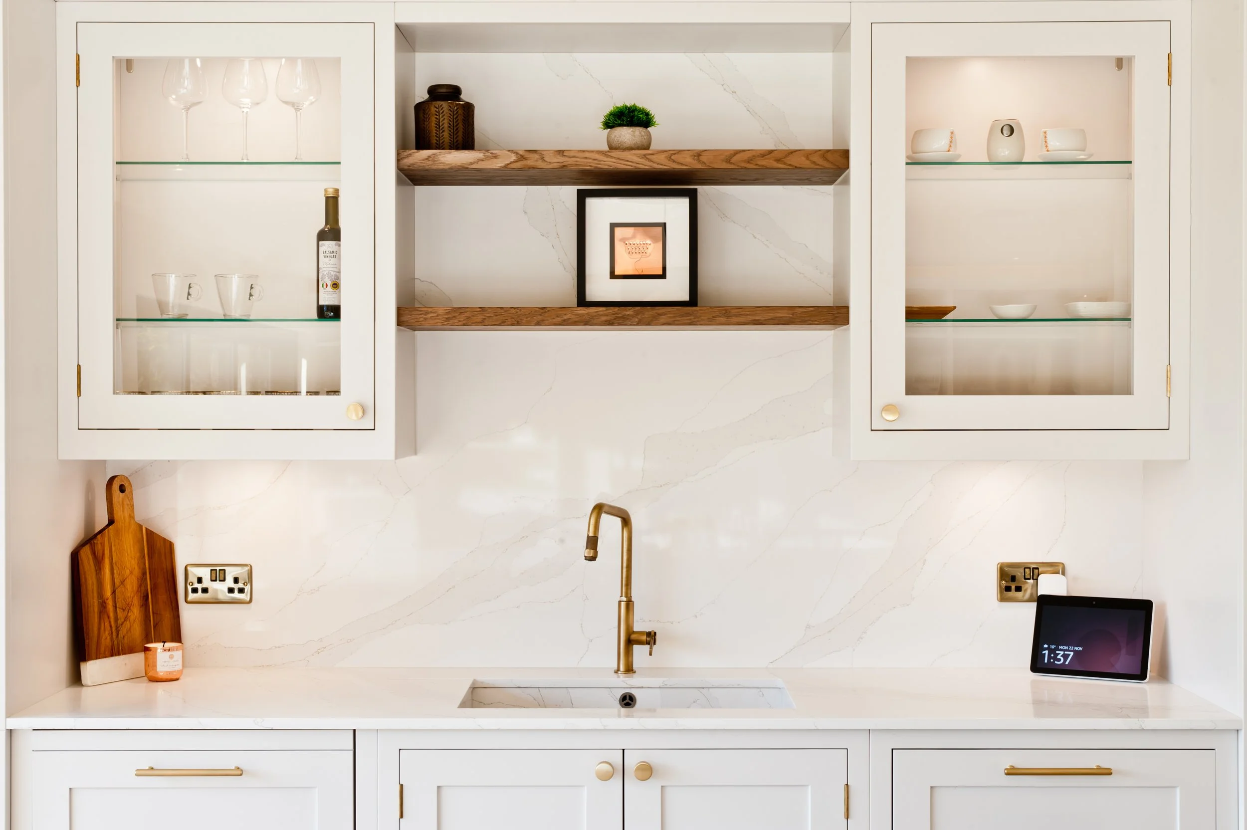 light painted shaker kitchen with recessed double sink and quartz worktops