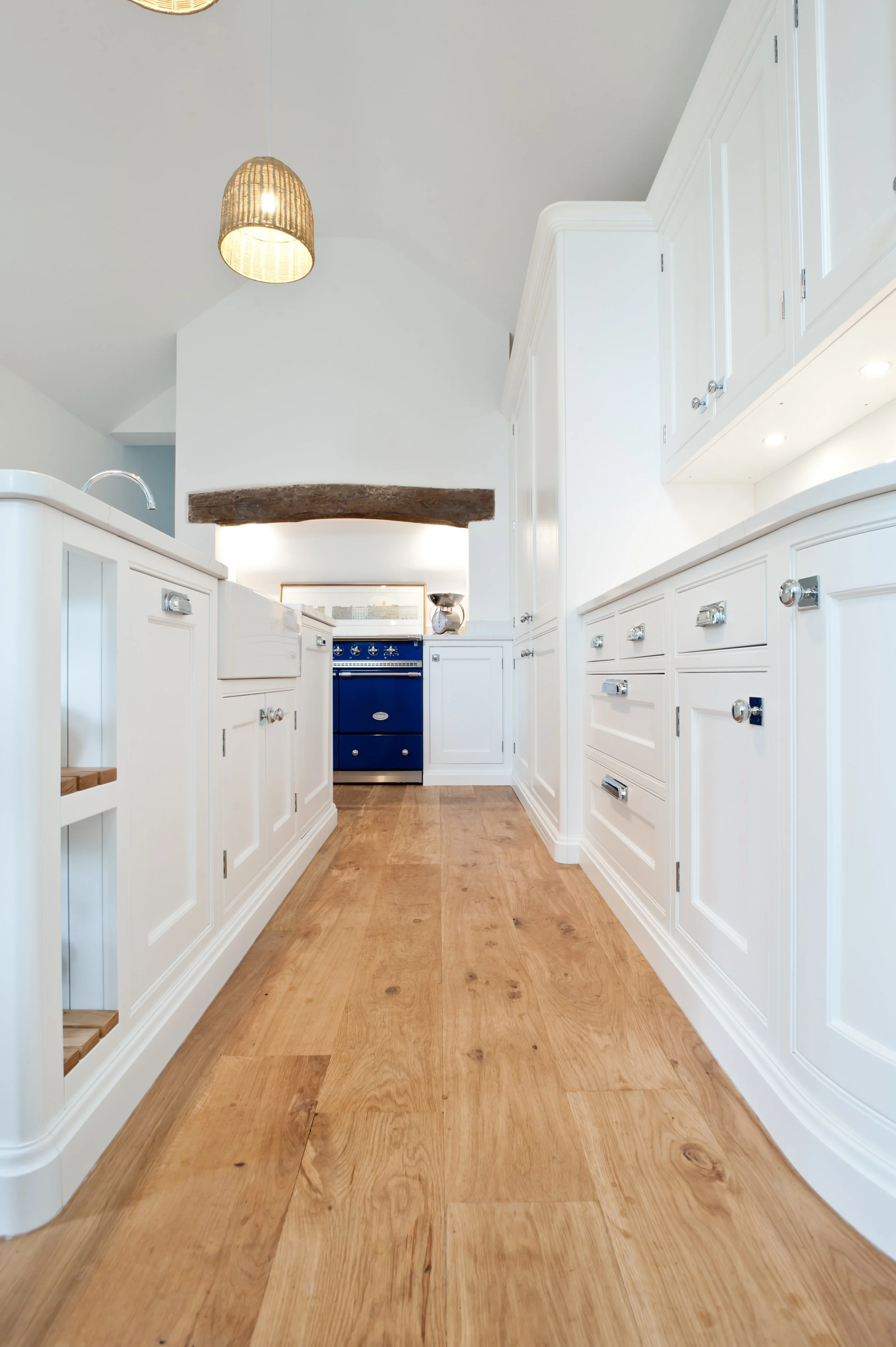 white kitchen and blue lacanche range oven