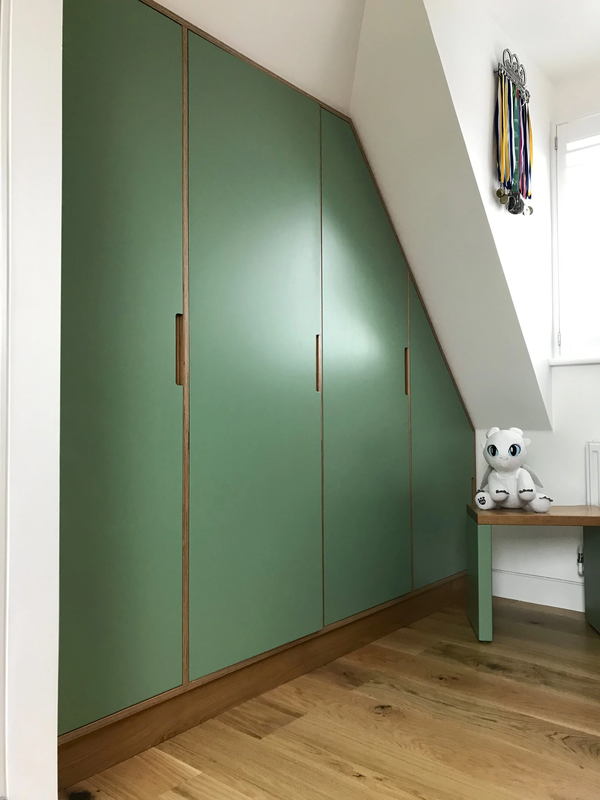 No such thing as an awkward angle. Bespoke fitted wardrobes designed precisely into the eaves.