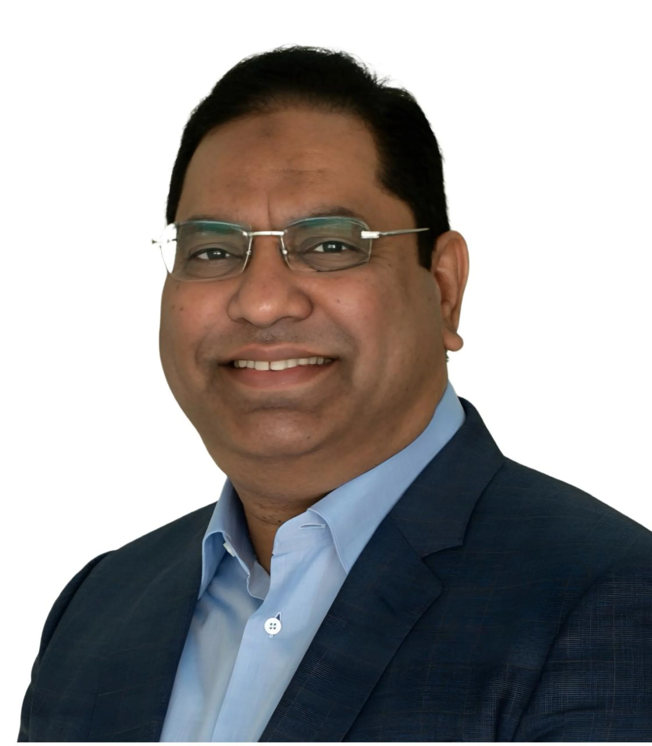 Founder smiling, wearing glasses, a dark suit, and a light blue shirt, against a white background.