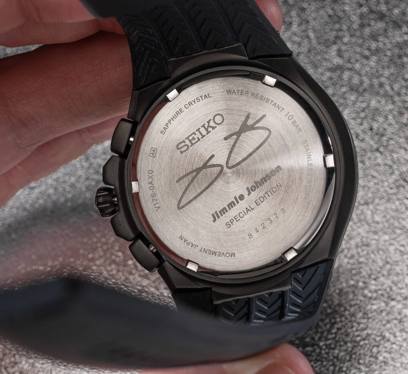 Back of a Seiko wristwatch featuring Jimmie Johnson's signature and special edition markings.