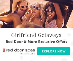 Three young women wearing sunglasses smiling and enjoying a road trip in a convertible car, with a text overlay advertising girlfriend getaways, red door spas, and exclusive offers.