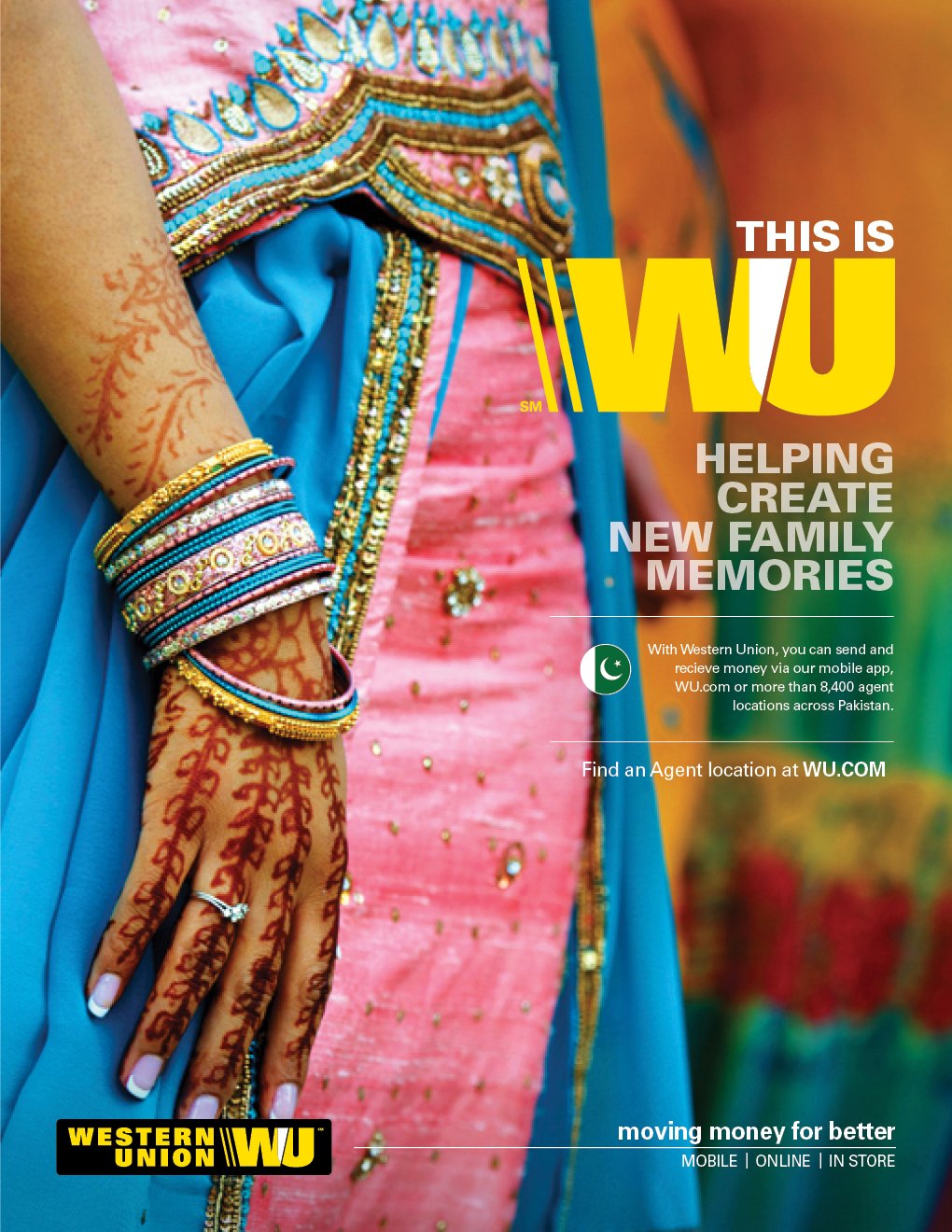 Close-up of a woman's hand and wrist, adorned with colorful bangles, a silver ring, and henna designs. She is wearing traditional colorful clothing with intricate embroidery.