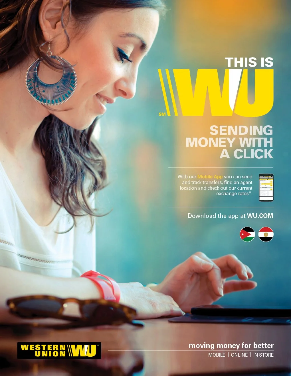A woman with earrings and a red wristband is using a tablet device. The advertisement promotes Western Union's WY mobile app for sending money, tracking transfers, and finding agents. The background is colorful with a gradient. Logos of Jordan and Eg
