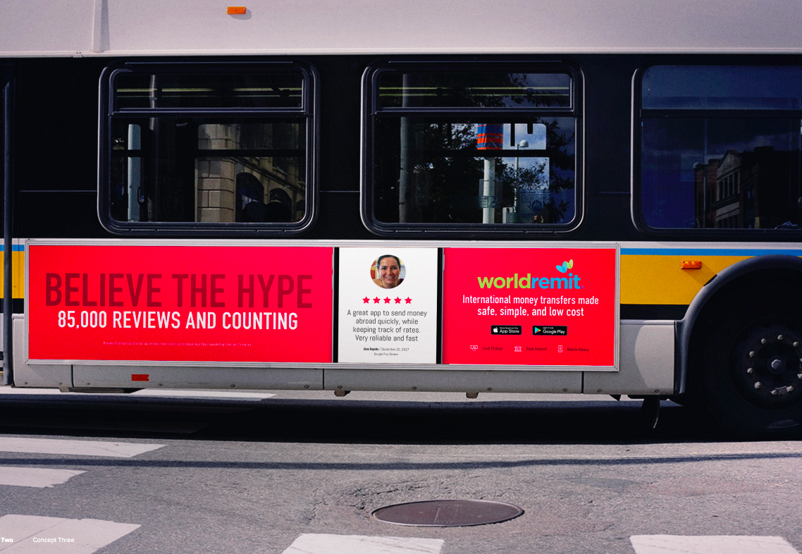 A bus with advertising for Worldremit, a money transfer service. The ad promotes trust and reviews, featuring a smiling woman's photo, star ratings, and app download icons.