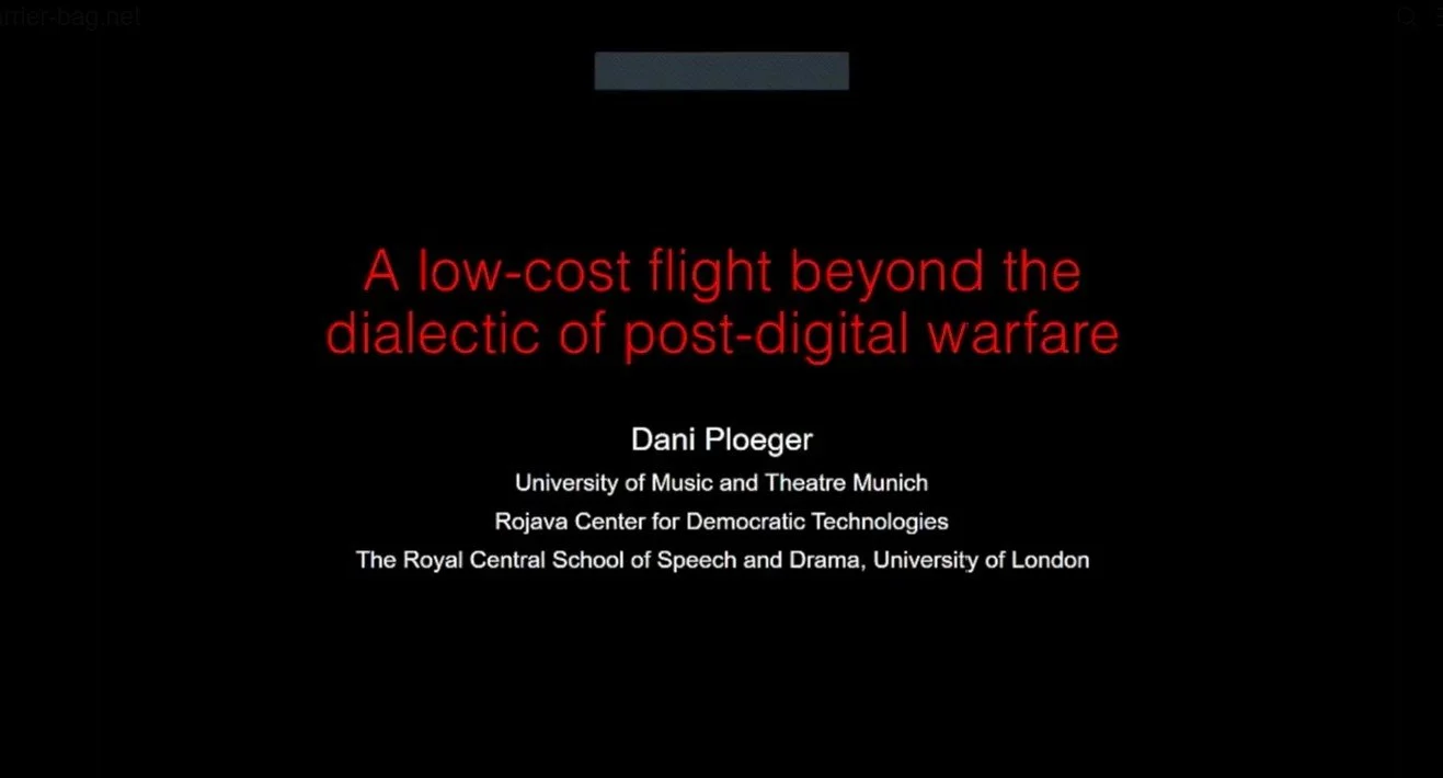 Presentation slide with the title 'A low-cost flight beyond the dialectic of post-digital warfare' in red text. Below are the presenter’s details: Dani Ploeger, University of Music and Theatre Munich, Rojava Center for Democratic Technologies, The Royal Central School of Speech and Drama, University of London.