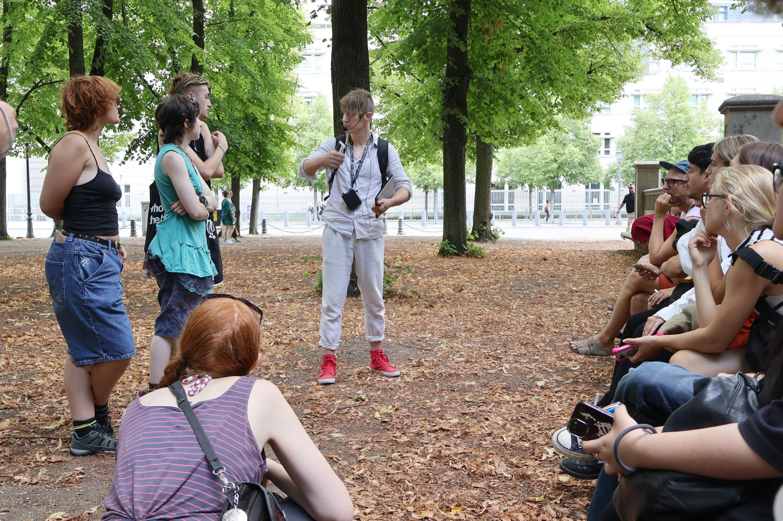 Teacher and students on street