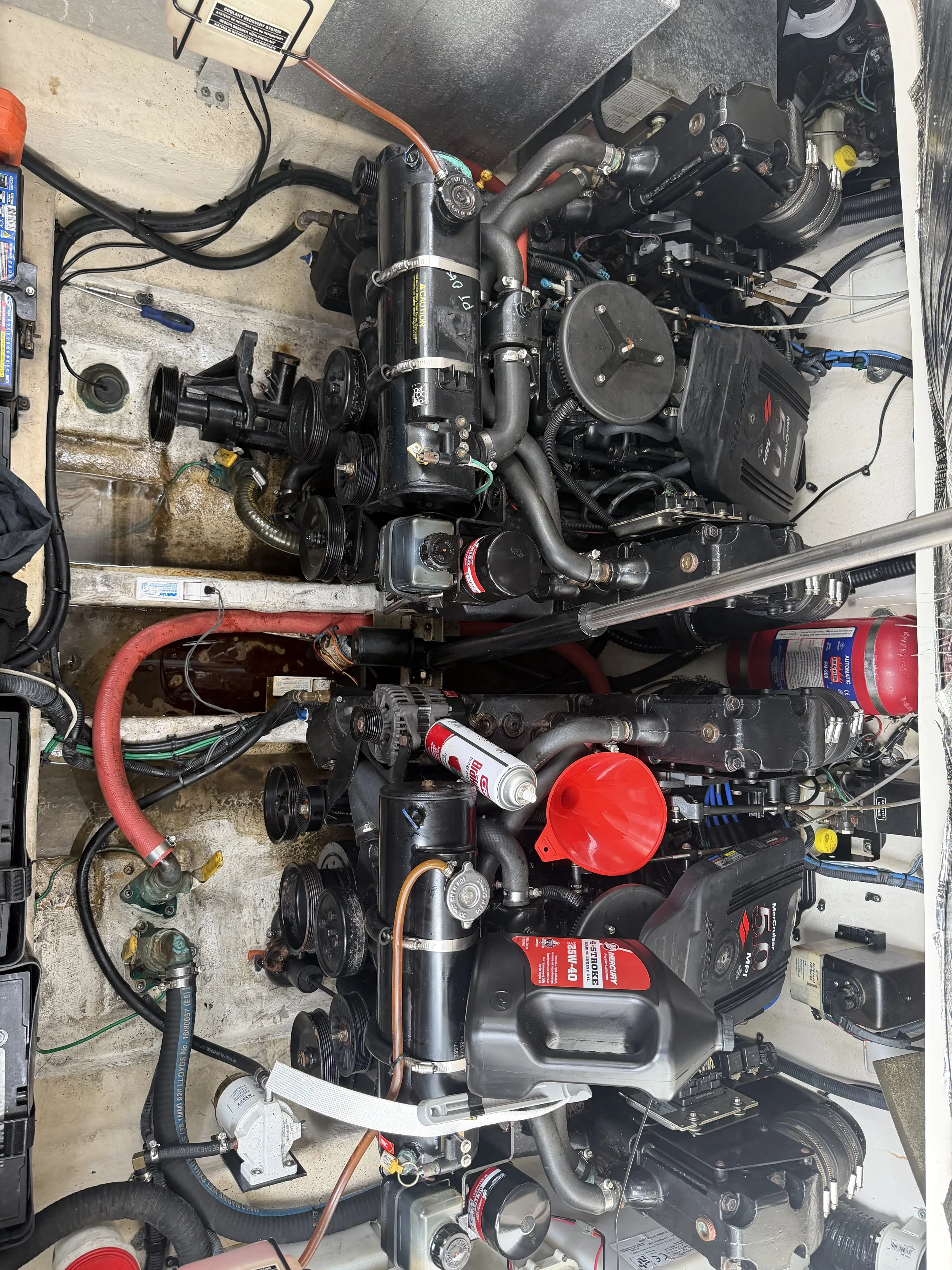 Complete Mercruiser engine service with impeller replacement. Tools in the area demonstrating efficient service.