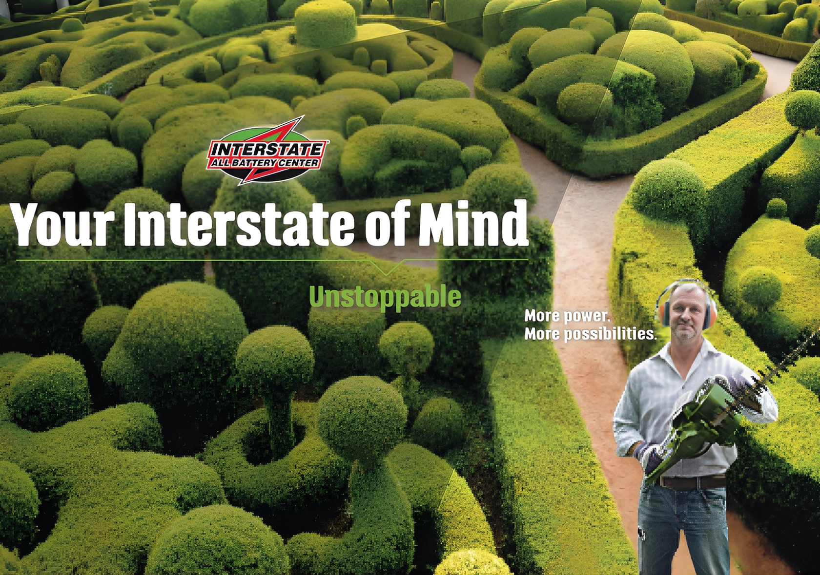 A person holding a hedge trimmer standing in front of neatly trimmed green bushes and trees in a garden, with a path winding through the hedges.