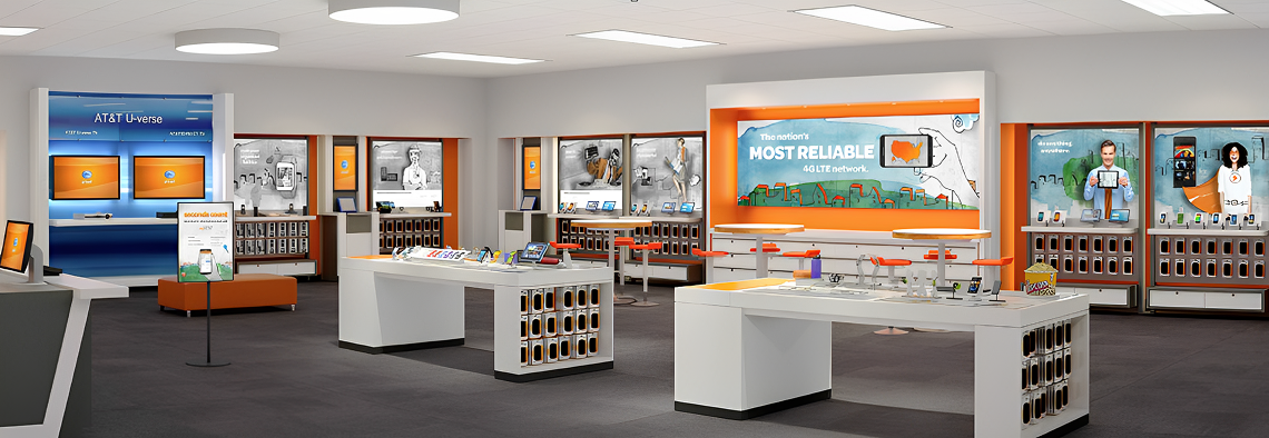 Interior of an AT&T store displaying various mobile devices and accessories on tables and shelves.