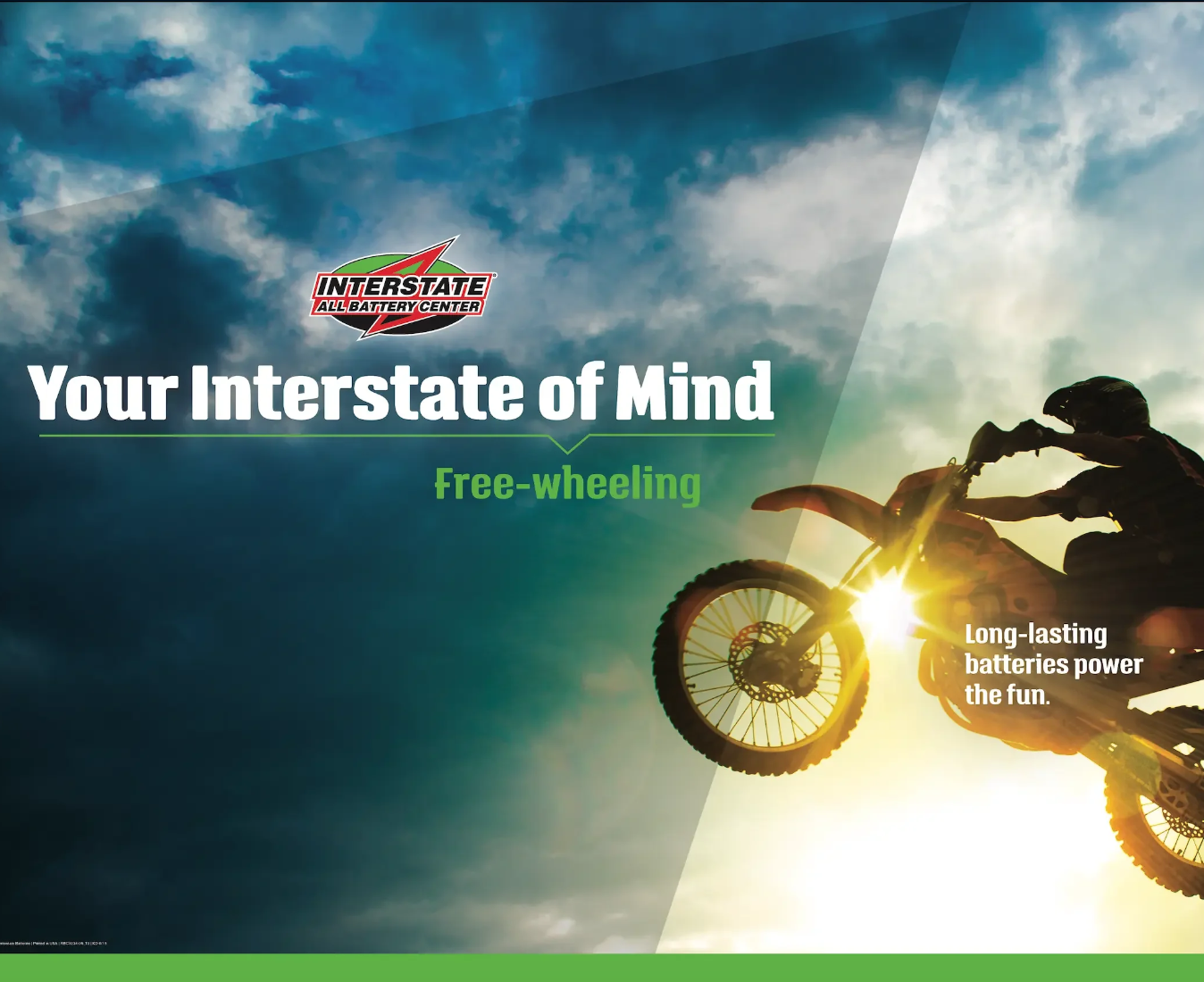 A person riding a dirt bike at sunset with a partly cloudy sky in the background, promoting long-lasting batteries for fun and free-wheeling adventure.