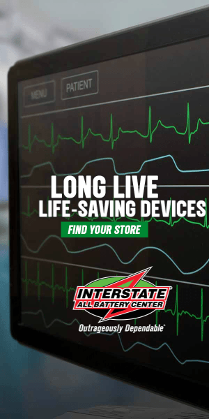 Medical monitor displaying heart rate lines with the overlay text 'Long Live Life-Saving Devices,' and a logo for InterState All Battery Center at the bottom.