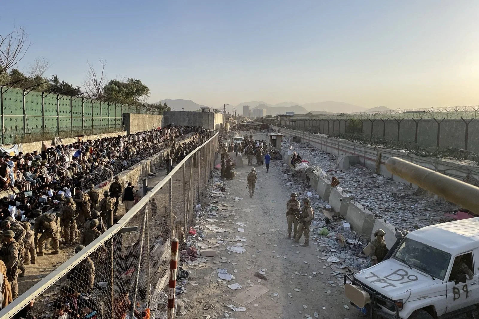 U.S. service members and civilians in the vicinity of Hamid Karzai International’s Abbey Gate in Kabul, Afghanistan, just prior to an ISIS-K suicide bomber attack, Aug. 26, 2021. 