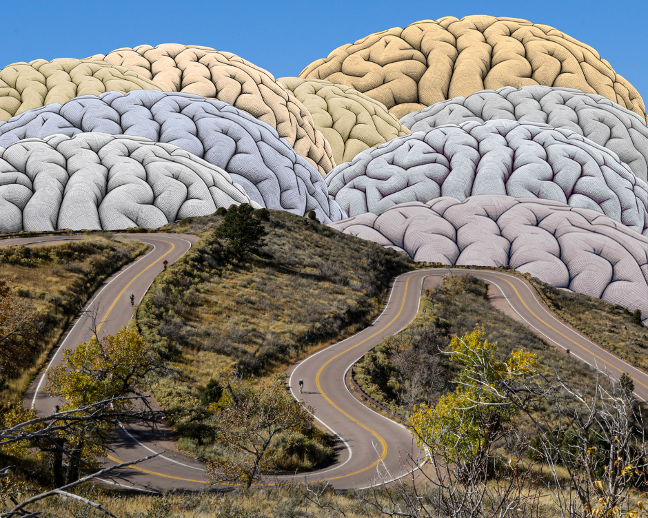 Image of a winding mountain road with images of the human brain in the background that represent mountains