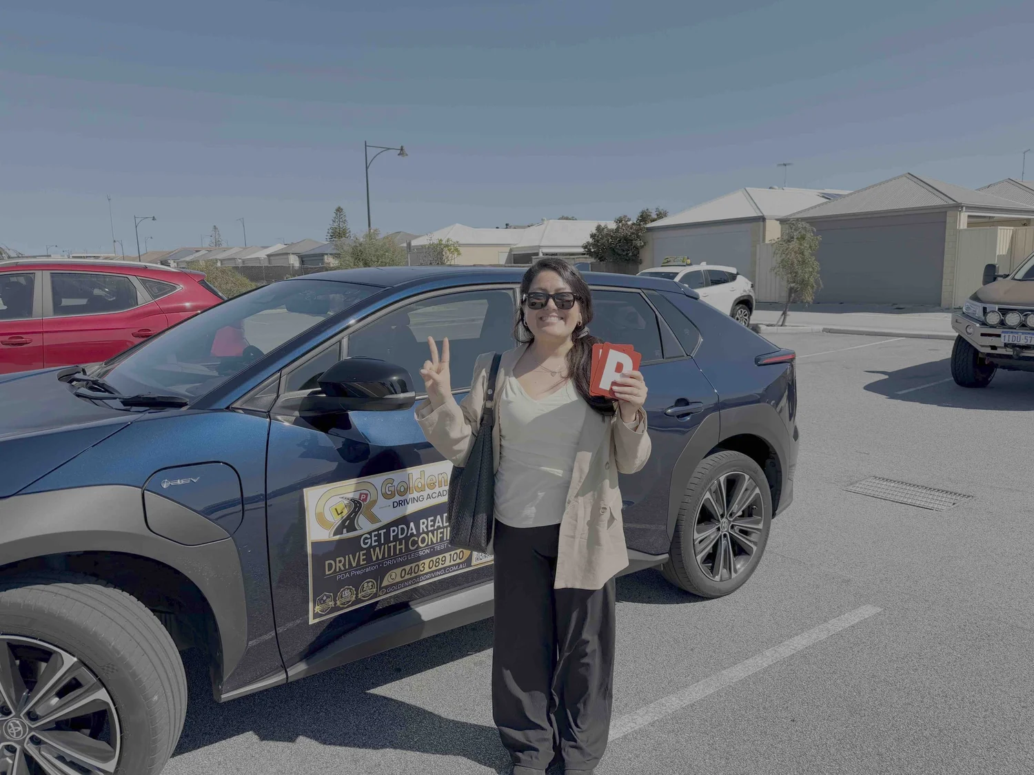 Golden Road Driving Academy learner celebrating after passing their Practical Driving Assessment in Butler WA.