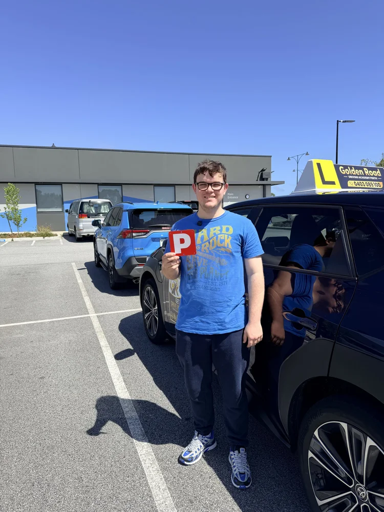 Oakland Purcell with his P plates after passing his driving test first time at Butler