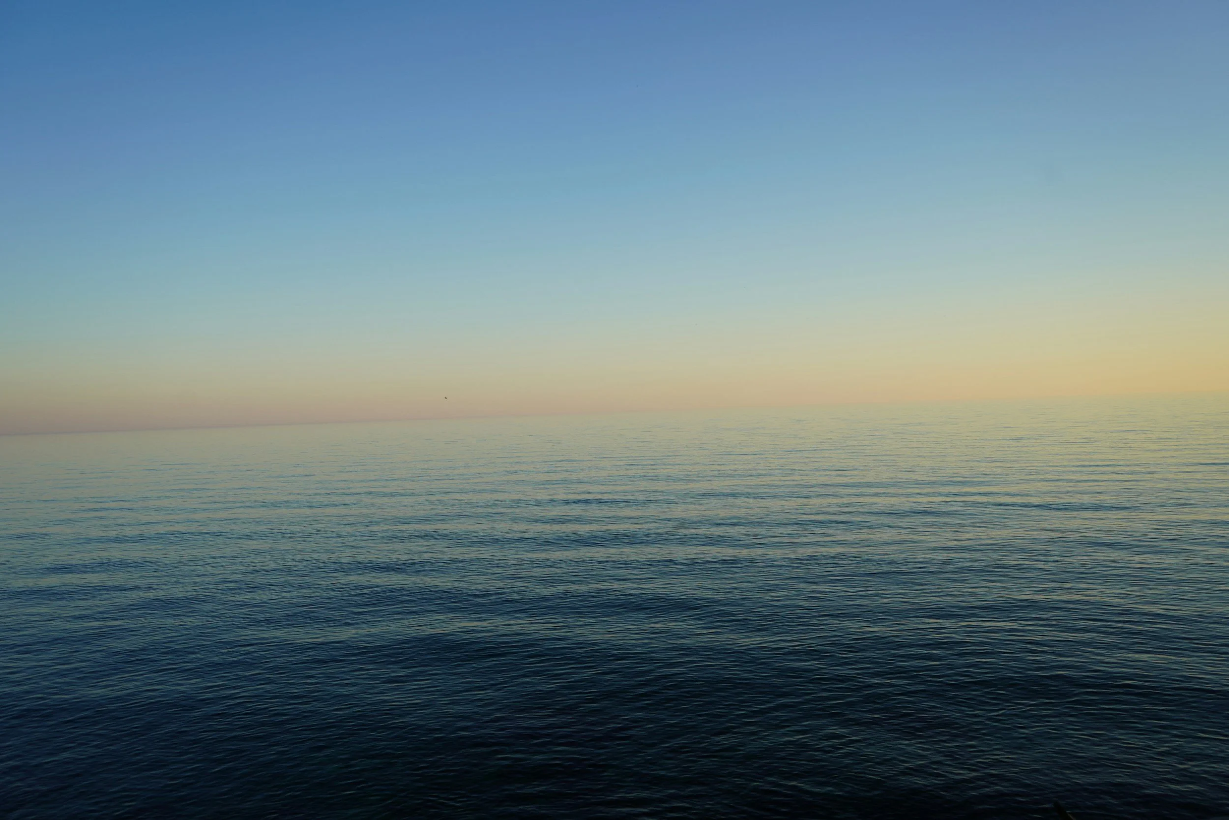 Slightly choppy sea with visible horizon representing emotional experience becoming more intense and difficult to tolerate