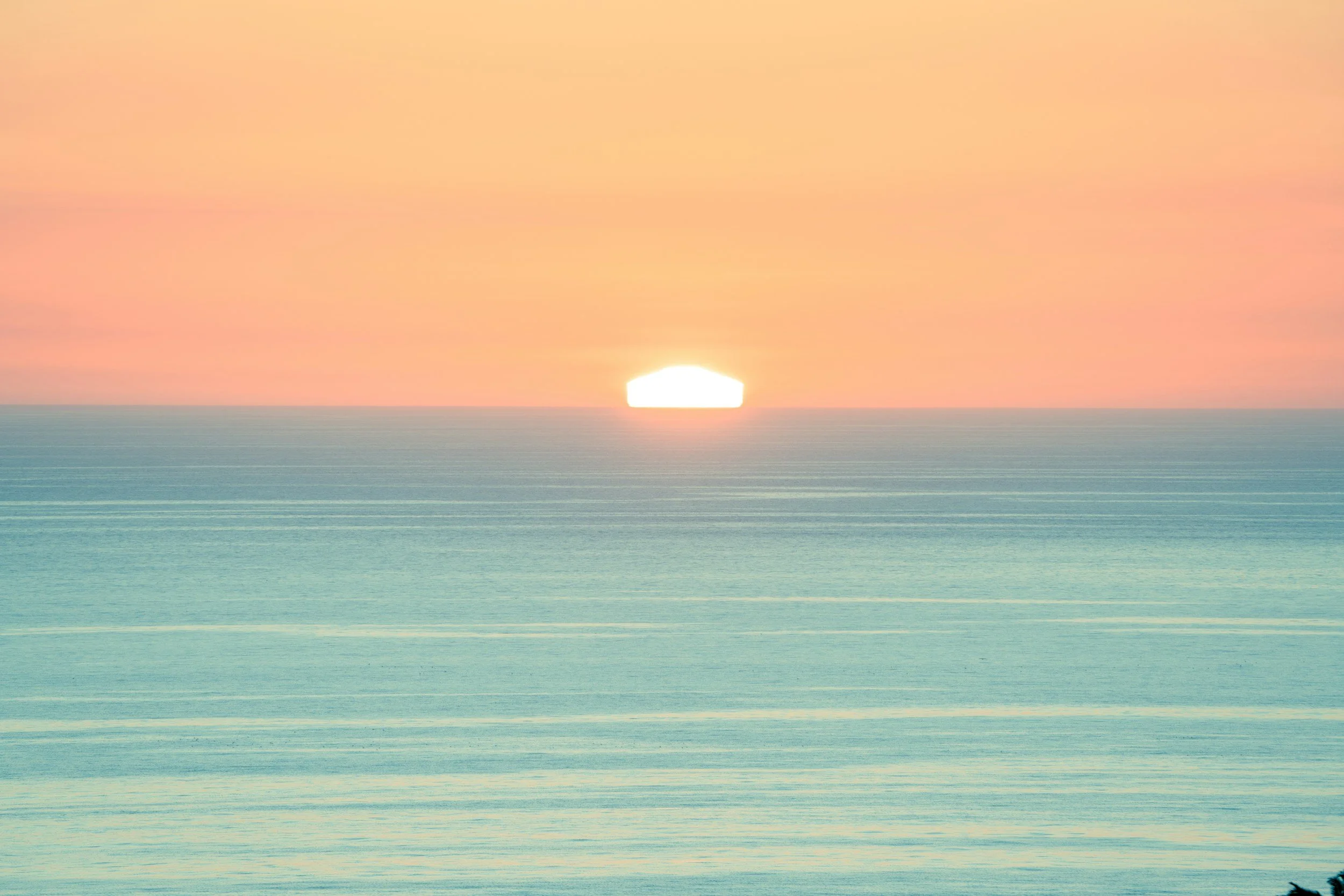 Calm sea with open horizon representing emotional capacity becoming more stable and manageable over time