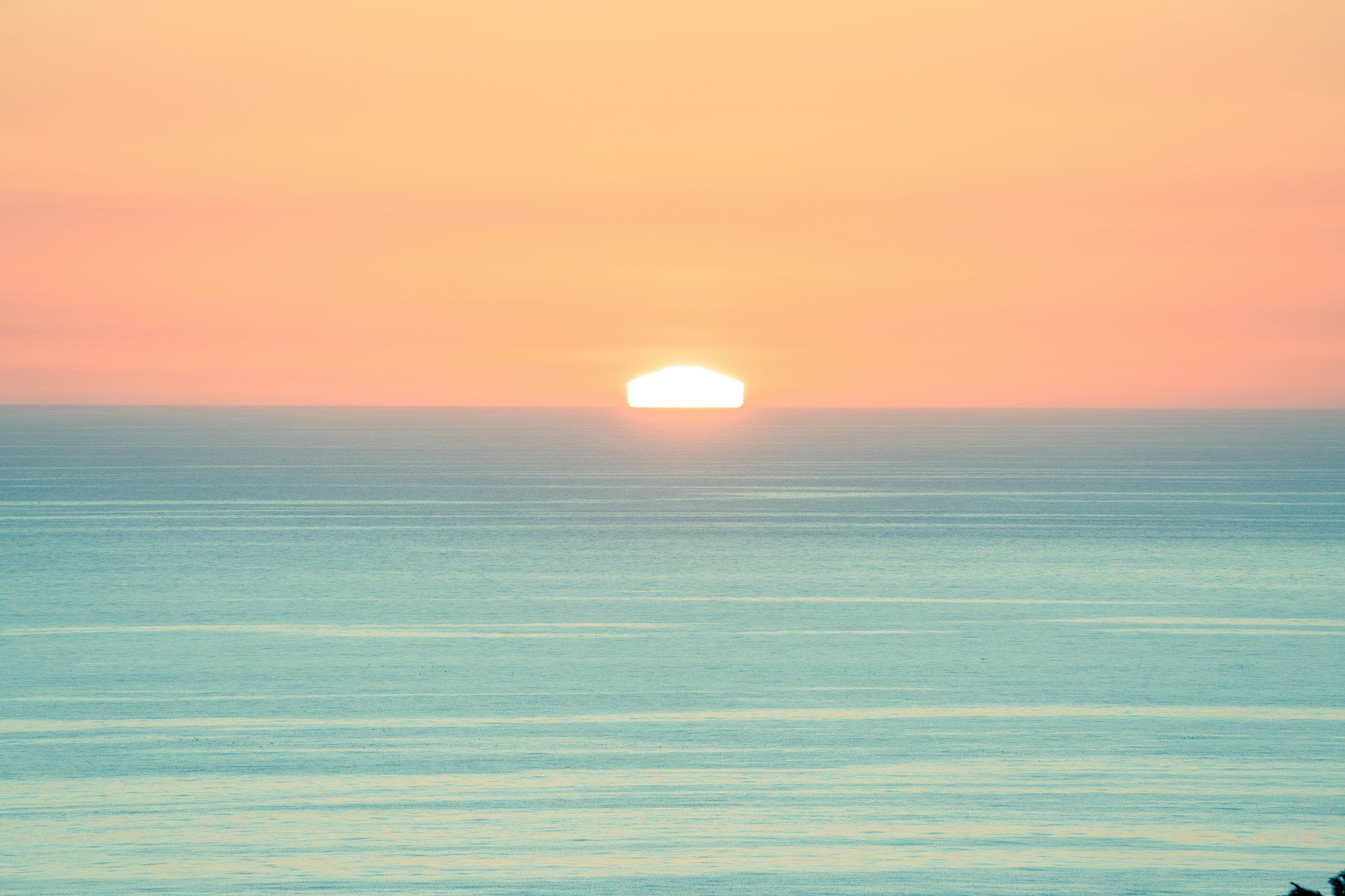 Calm sea with open horizon representing emotional capacity becoming more stable and manageable over time