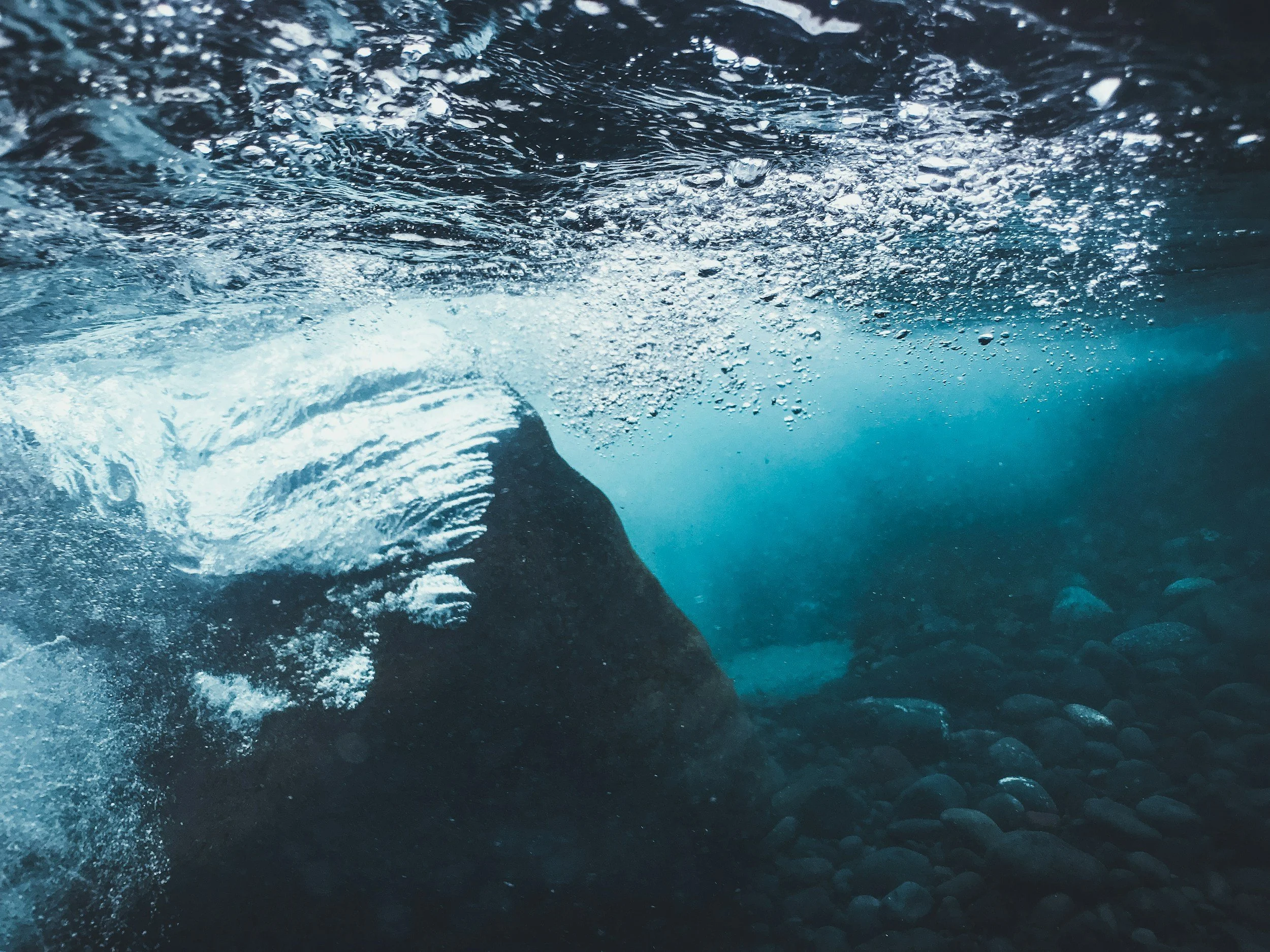 Dark, choppy water with small waves forming, representing rising internal tension and anxiety