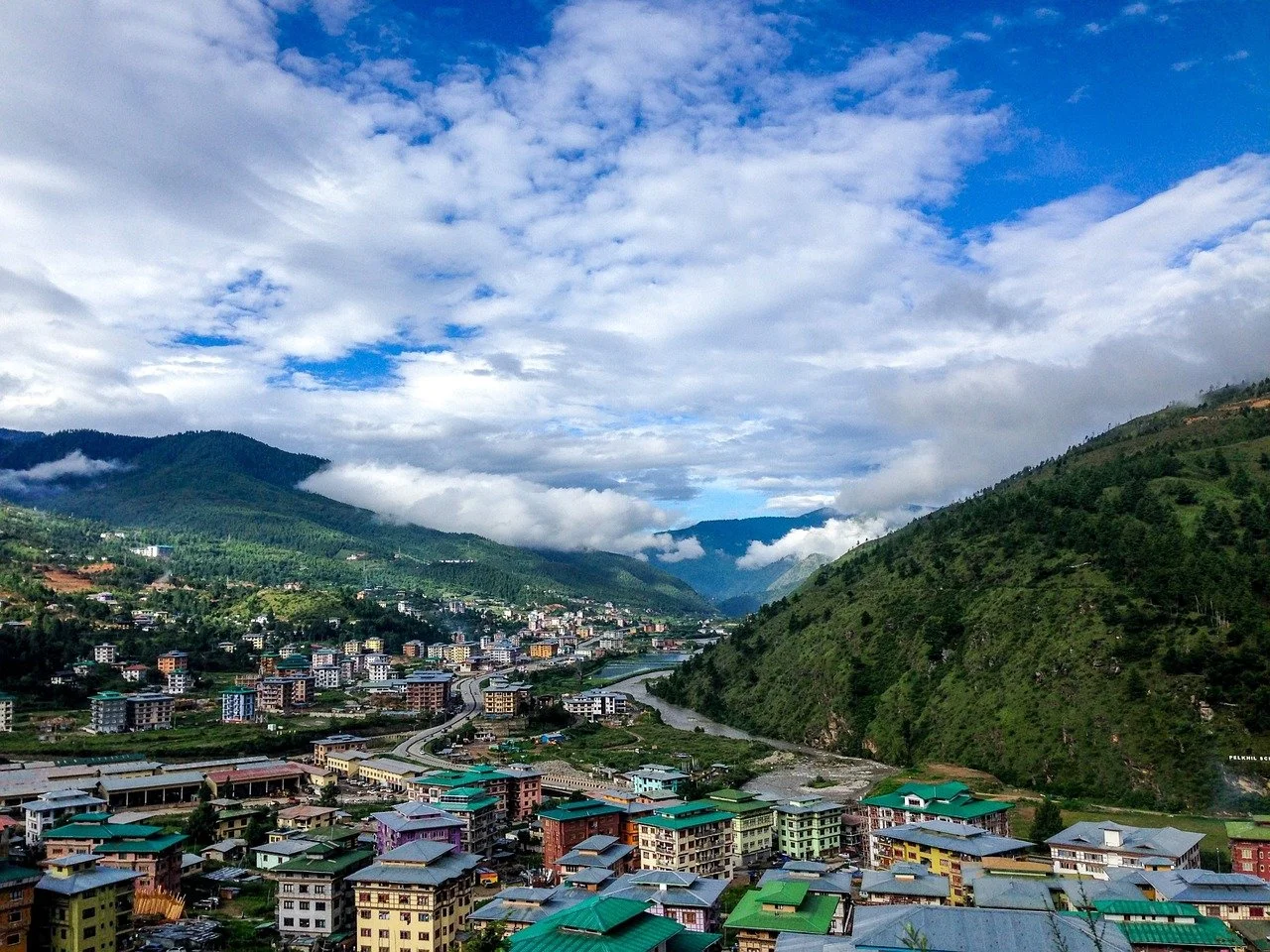 Colorful hillside cityscape and green valleys of Bhutan.