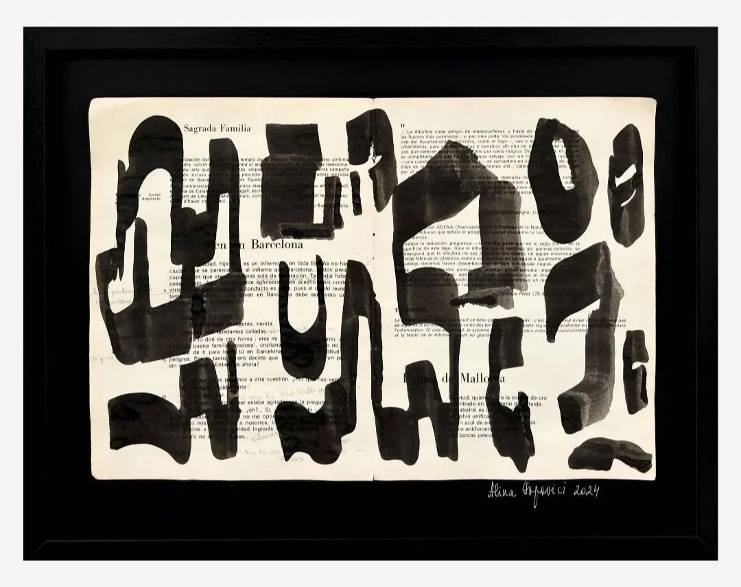 A framed artwork overlaying a vintage book page with bold, abstract black brushstrokes. The artist's signature and date are in the bottom right corner.