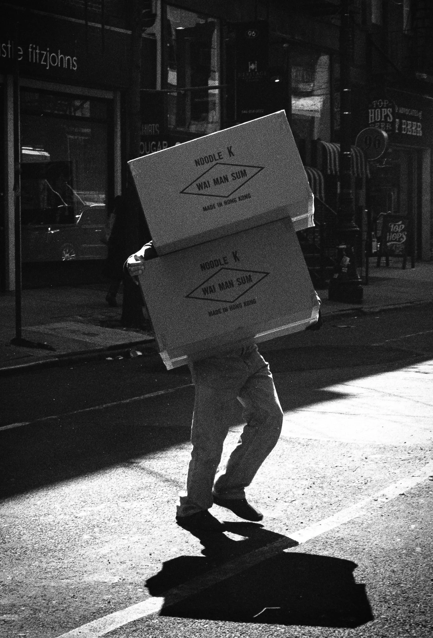 Man carrying boxes. New York City. 2016