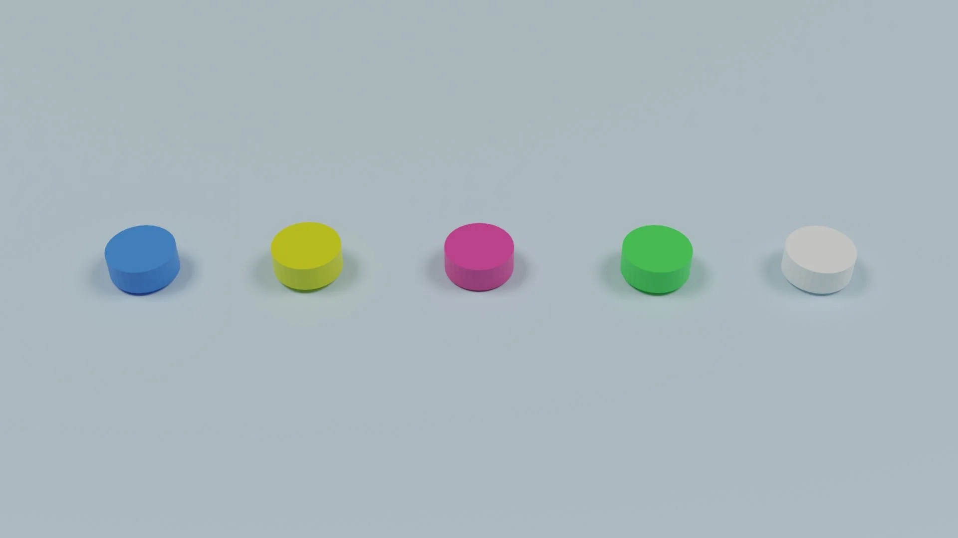 Five colored pills arranged in a row, from left to right: blue, yellow, pink, green, and white, on a light grey background.
