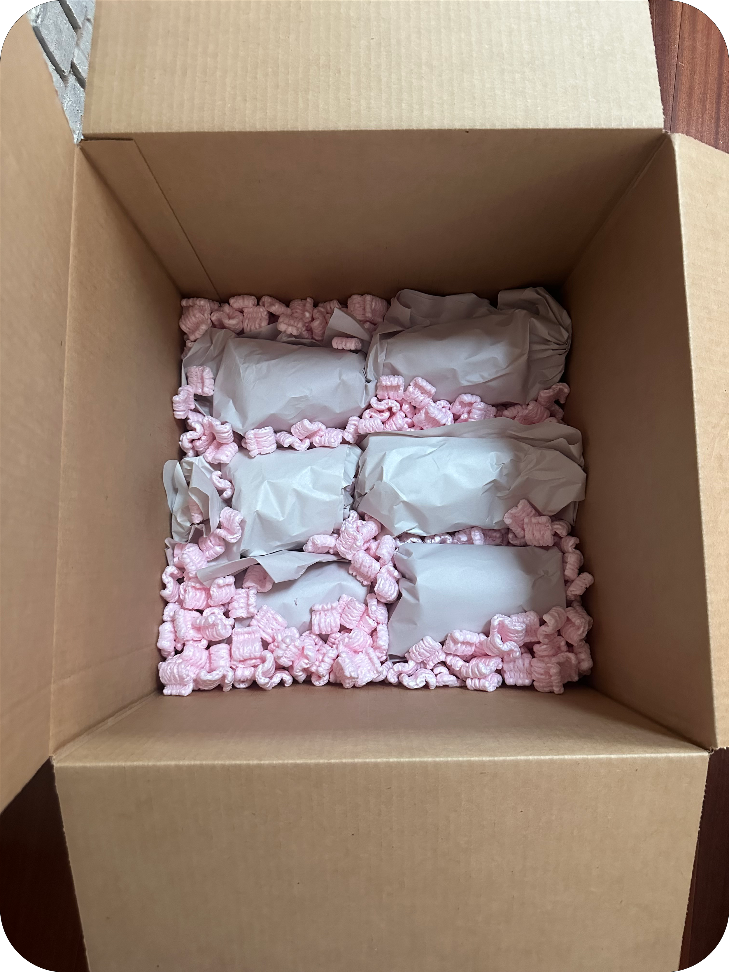 Moving box with household items packed safely for a local or long-distance move by the Easy Peasy, LLC crew