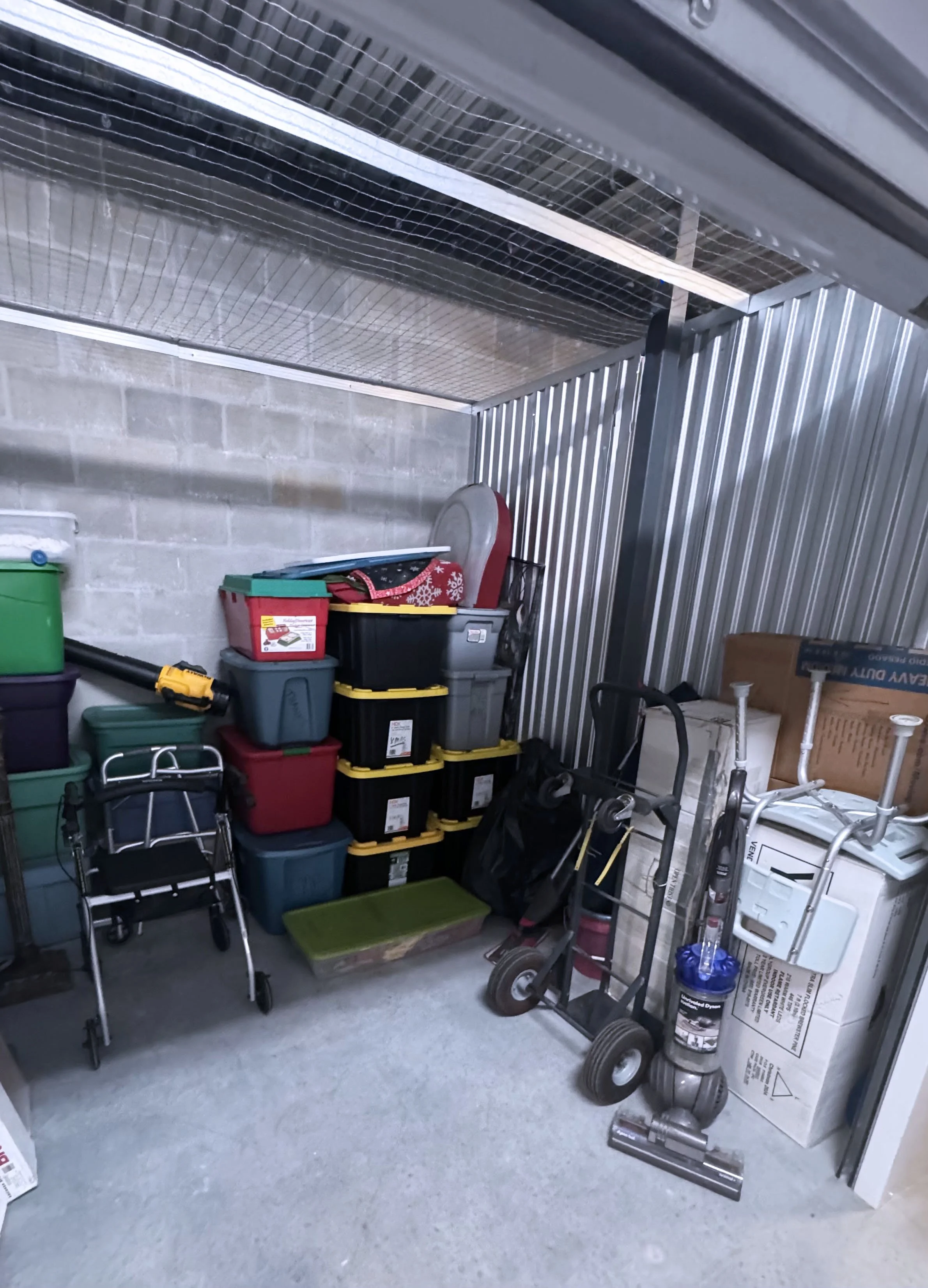 Neatly packed storage unit with organized boxes and belongings, representing professional storage moving and organization services by Easy Peasy Moving, LLC in Central Florida.
