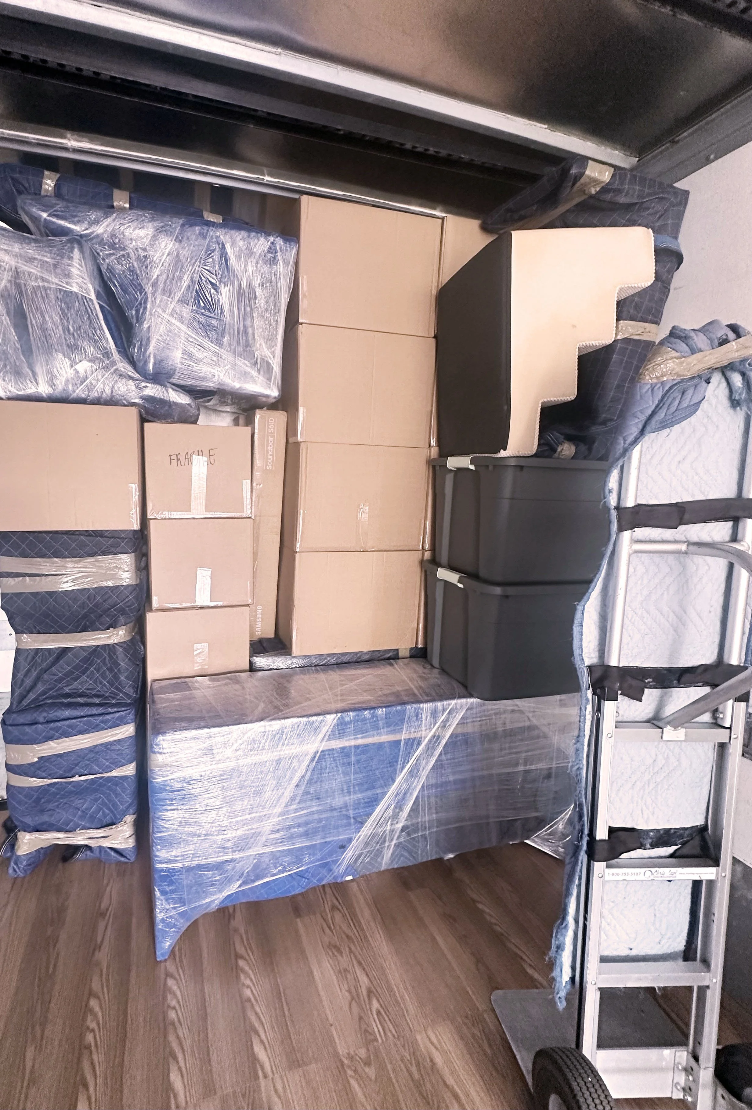 Packed moving truck for a small move by Easy Peasy Moving, LLC in Central Florida, with furniture, boxes, and household items securely loaded and organized by professional movers.