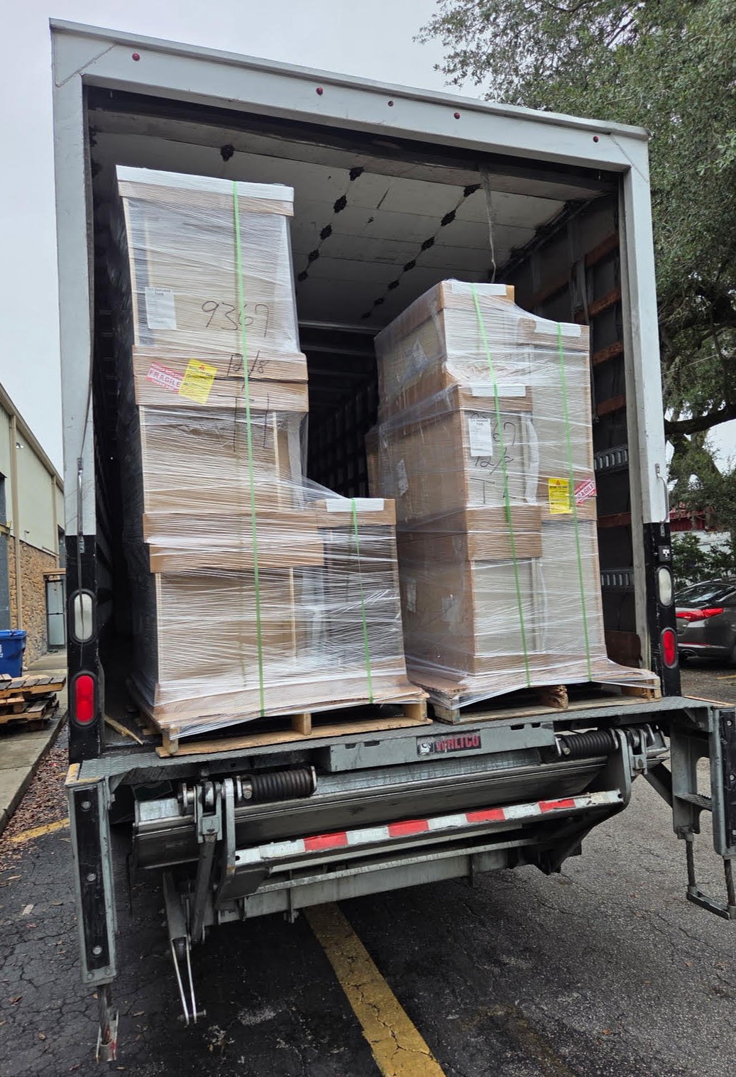 Loaded moving truck for a commercial and office move by Easy Peasy Moving, LLC in Central Florida, with office furniture, equipment, and boxes securely packed and organized.
