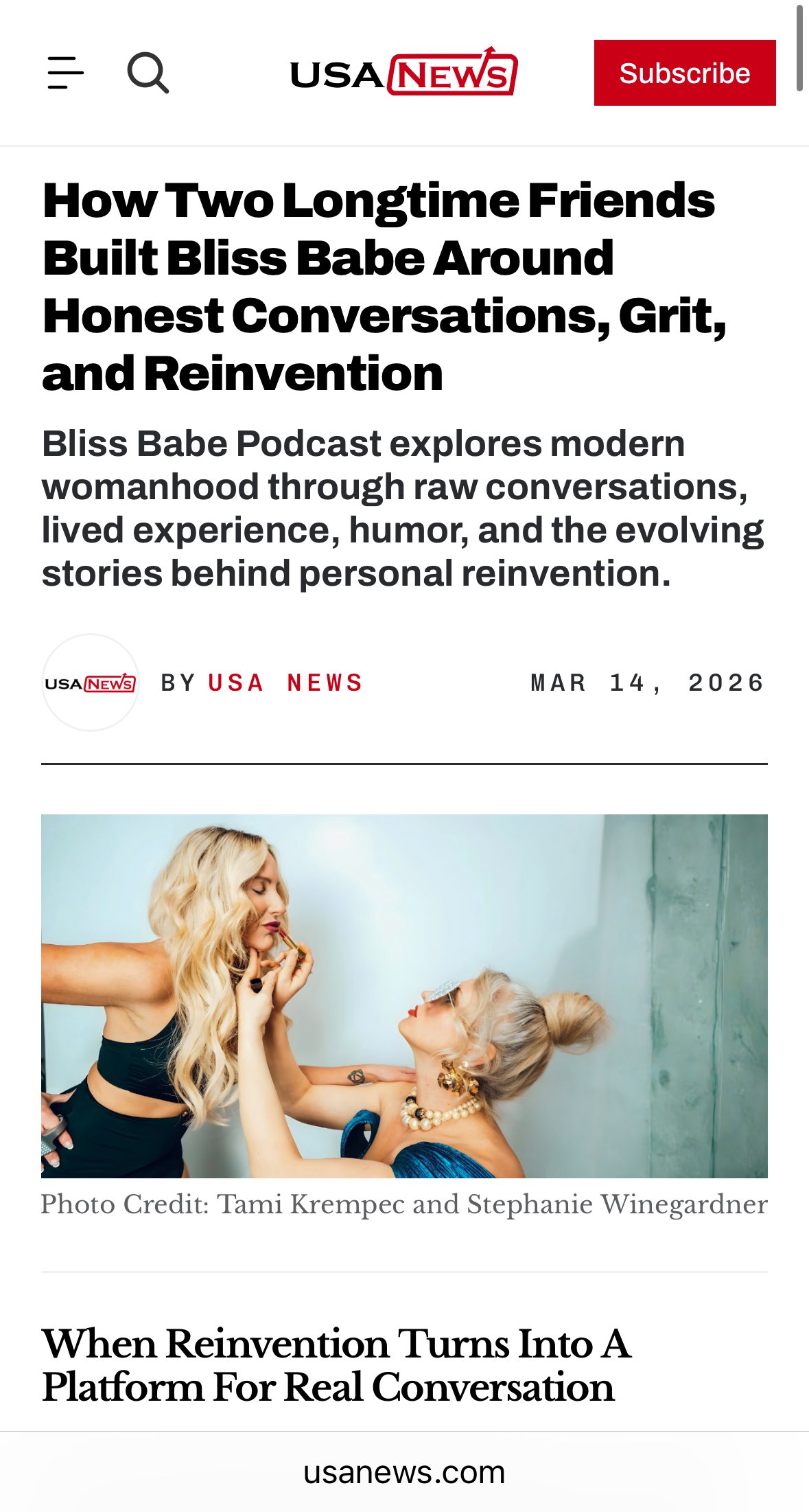 Photo of two women, one applying makeup to the other, in a close-up shot indoors.