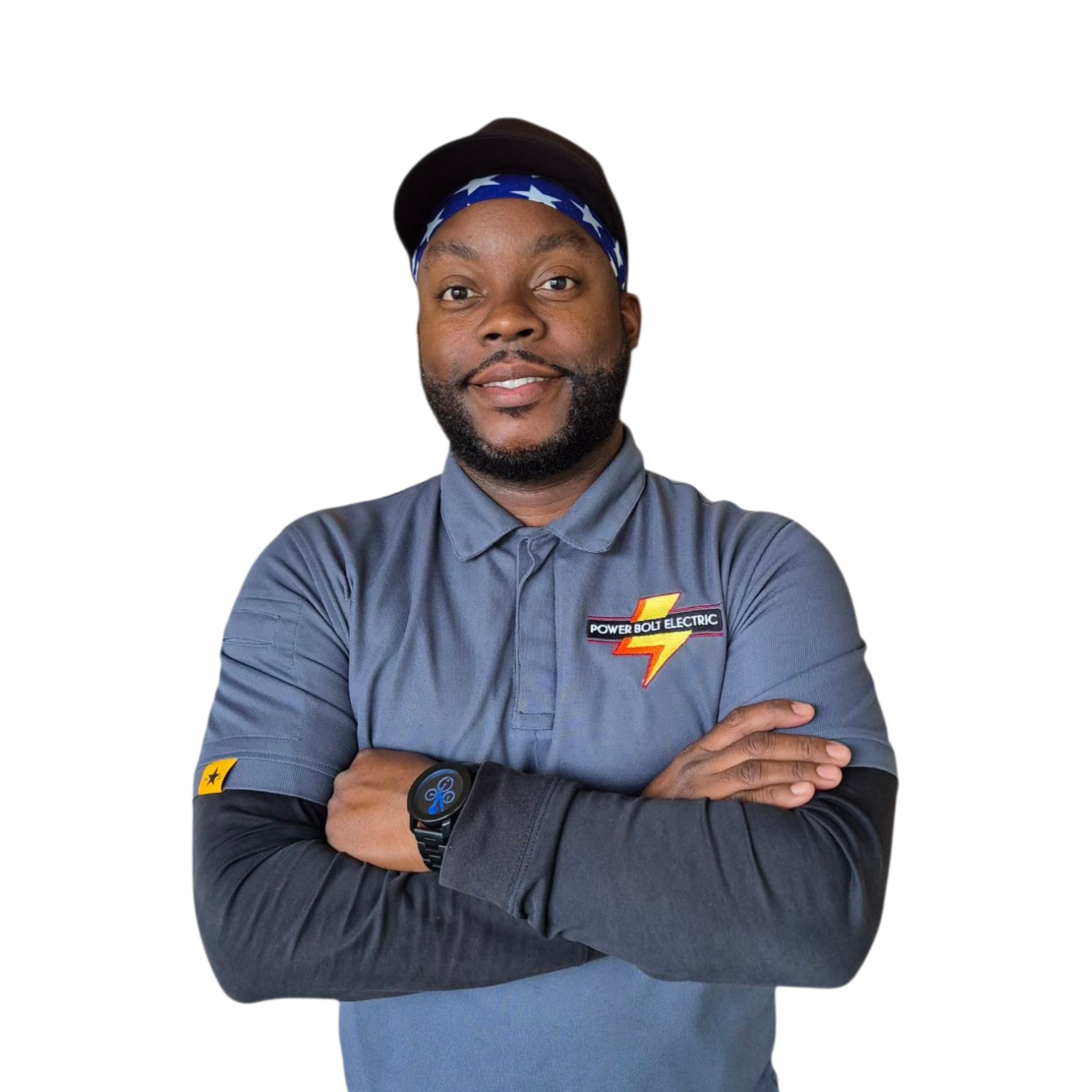 Emergency electrician in Boca Raton wearing a gray uniform with 'Power Bolt Electric' logo, black cap, and a blue star-patterned bandana. He has arms crossed, smiling, wearing a smartwatch.