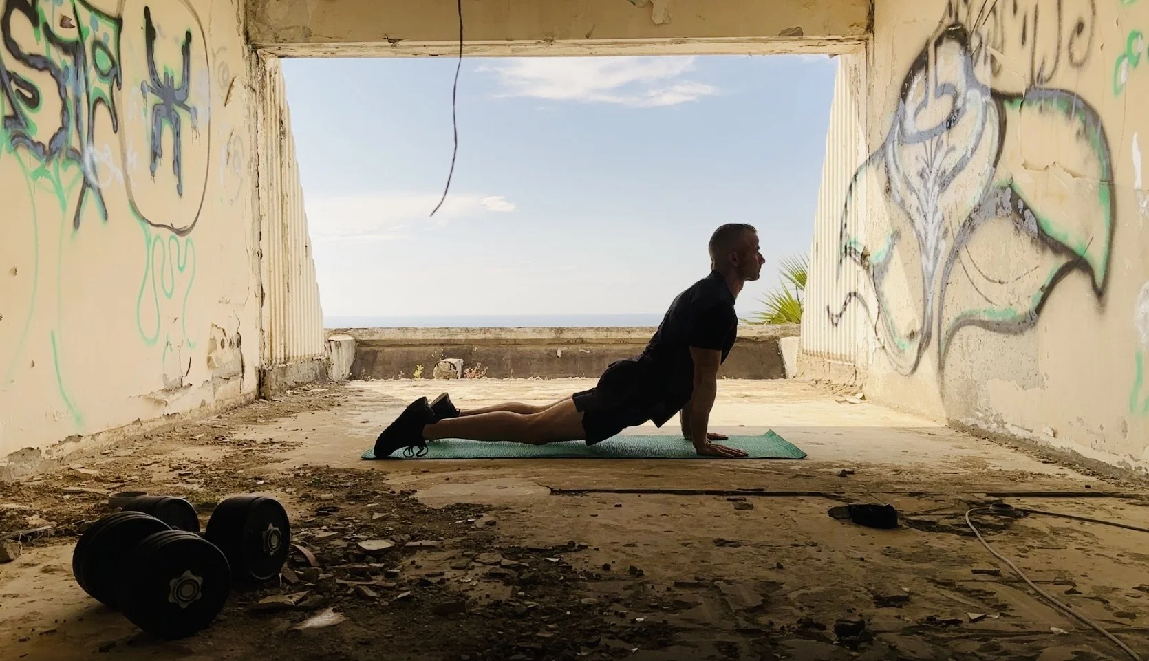 photo of man in upward dog position