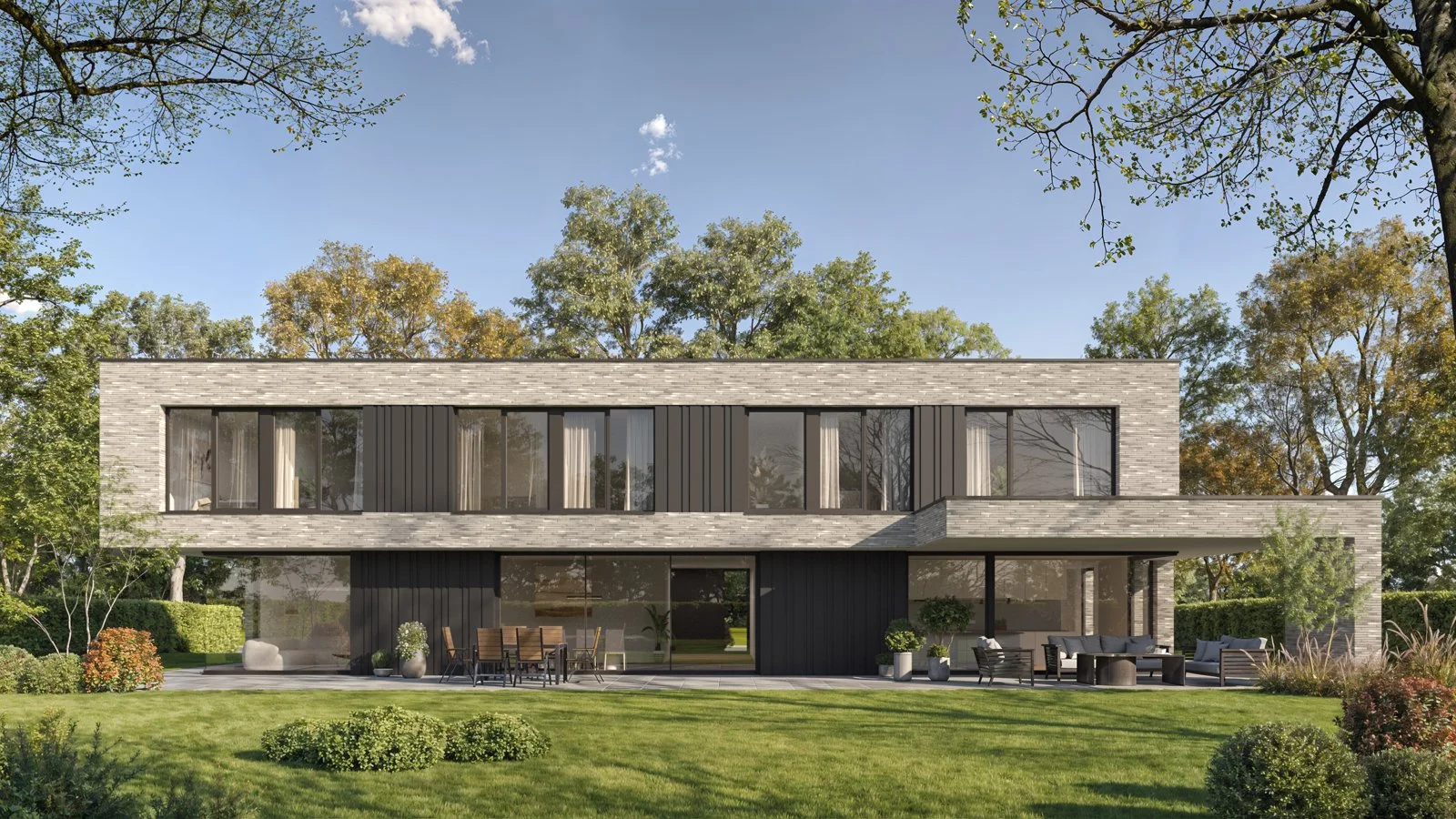 Modern two-story house with large glass windows, dark and light exterior walls, surrounded by a landscaped garden with outdoor seating, trees, and a clear blue sky.