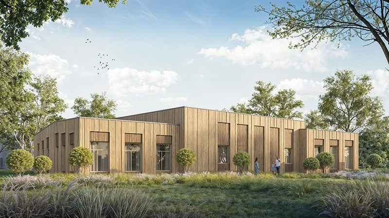 Modern wooden building surrounded by trees and grass, with a few people standing outside during daytime.