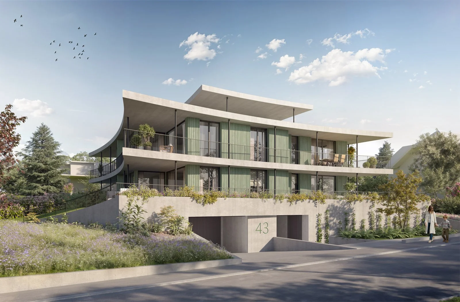 Modern multi-story residential building with curved balconies, large windows, and green vertical accents, surrounded by landscaped greenery and a woman walking with a child on a sidewalk.