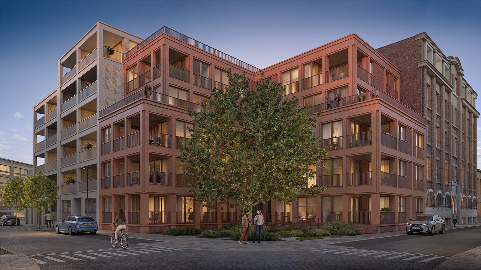 Modern multi-story residential building with balconies, a sidewalk with pedestrians and parked cars, and a cyclist crossing the street during evening