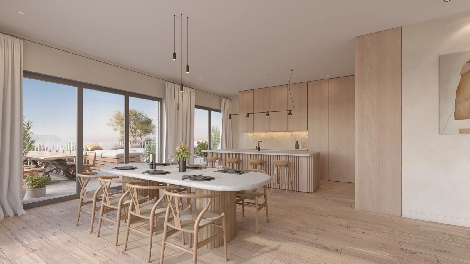 Modern dining room with a large oval table set with black plates, wine glasses, and a flower centerpiece, surrounded by wooden chairs. Sliding glass doors lead to an outdoor patio with a table and cushioned seating, overlooking outdoor greenery and a