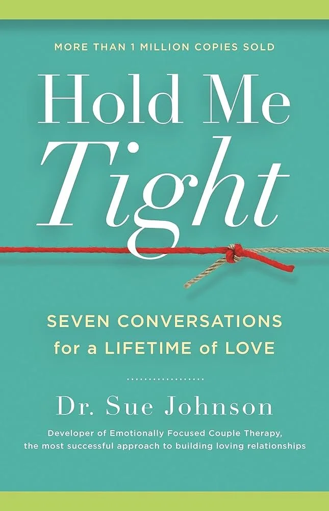 Book cover titled 'Hold Me Tight: Seven Conversations for a Lifetime of Love' by Dr. Sue Johnson, with a red and beige rope tied in a knot on a turquoise background.