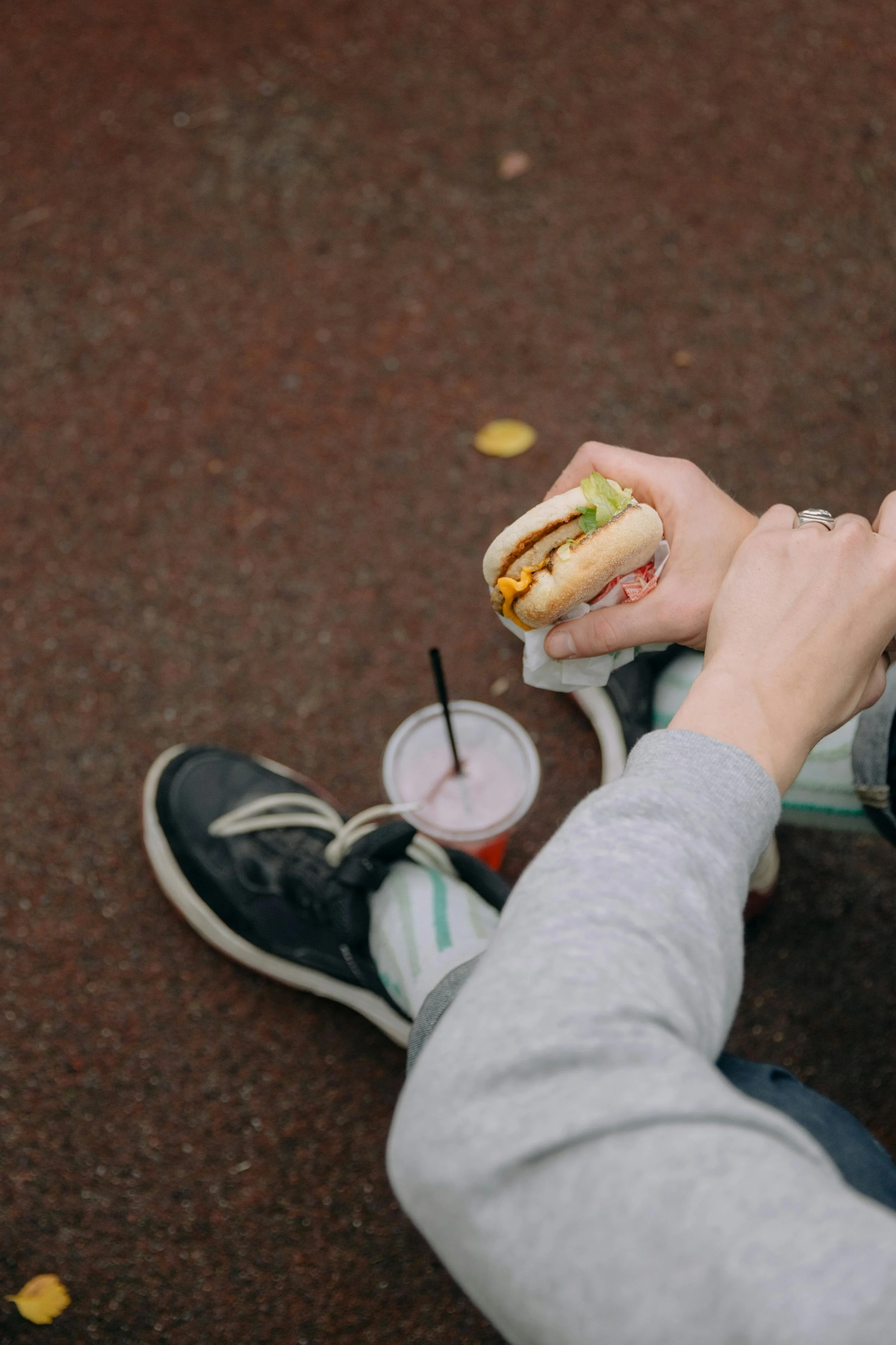 Kid holding fast food sandwich