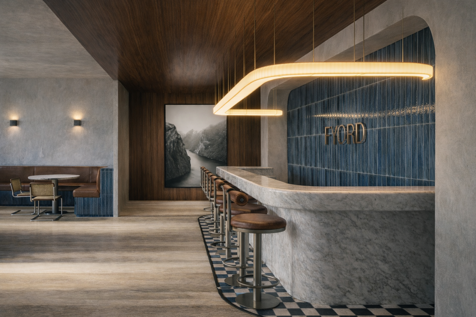 Bar com balcão de mármore branco, cadeiras de couro e parede com azulejos azuis e a placa 'FYORD'.