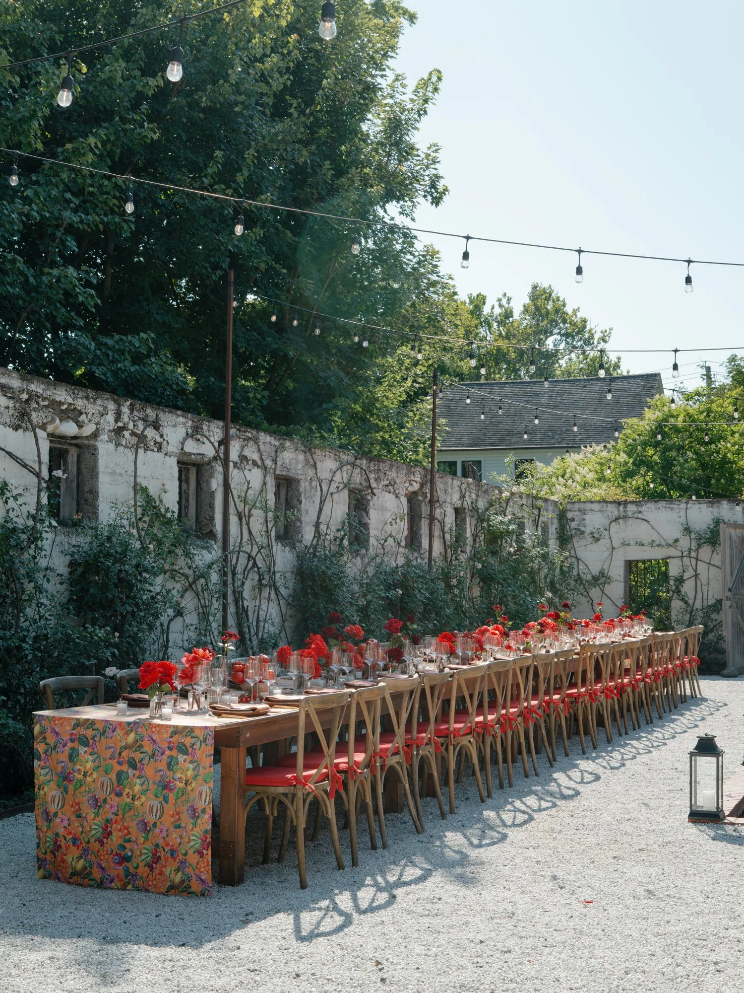 Long al fresco dinner table with string lights in the walled garden at Valley Rock Inn, Sloatsburg, NY, photographed by Jenny Fu.