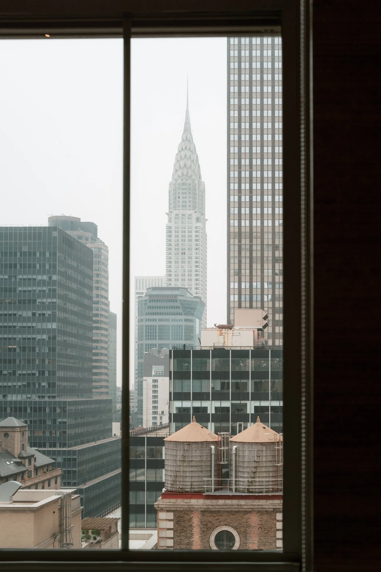 View of the Chrysler Building through a suite window at the Waldorf Astoria New York, photographed by Jenny Fu.