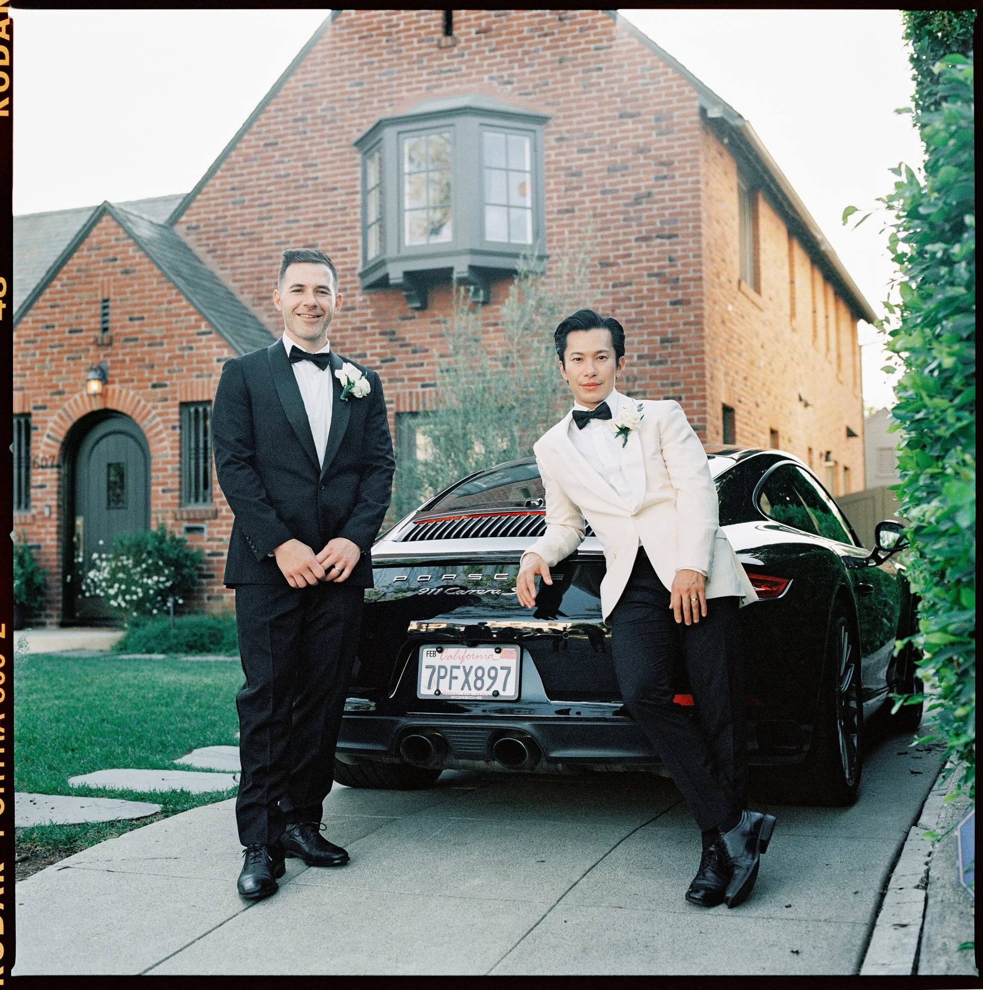 dm-01-grooms-in-tuxedos-standing-by-porsche-los-angeles-jenny-fu.jpg