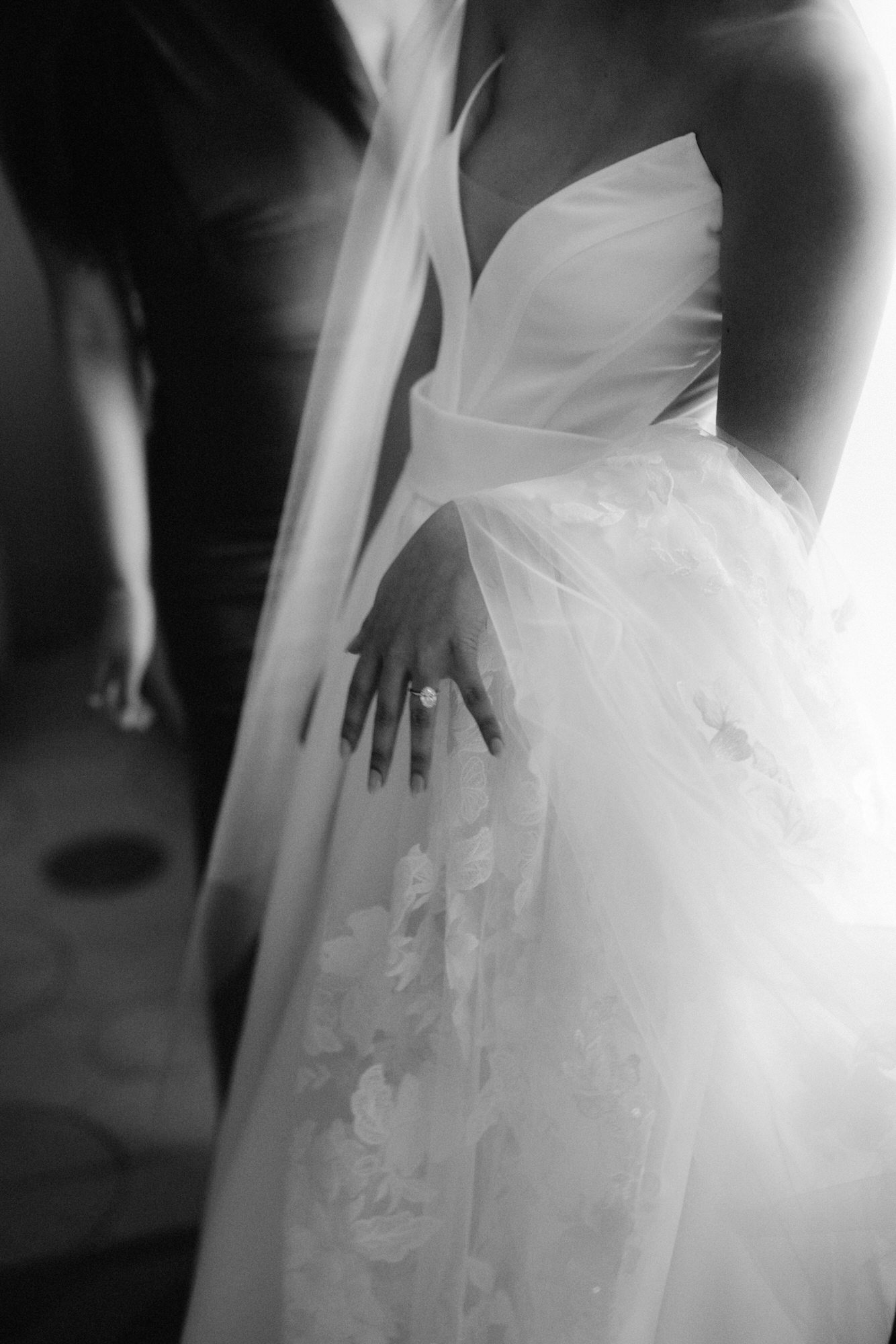 Soft black-and-white detail of the bride’s engagement ring and delicate veil at Caruso, A Belmond Hotel in Ravello, Italy, photographed by Jenny Fu.