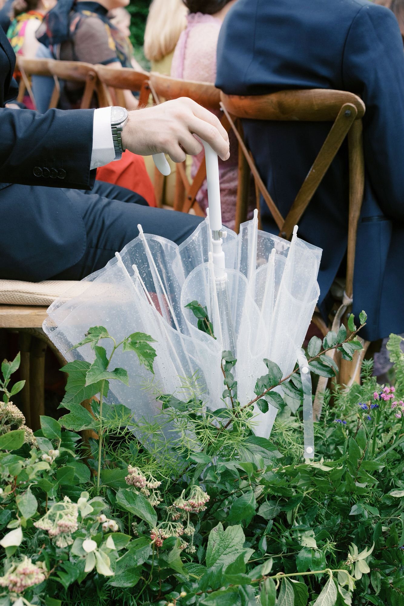 aa-0682-guest-holding-clear-umbrella-during-ceremony-troutbeck-amenia-ny-planned-by-ashley-douglass-jenny-fu.jpg