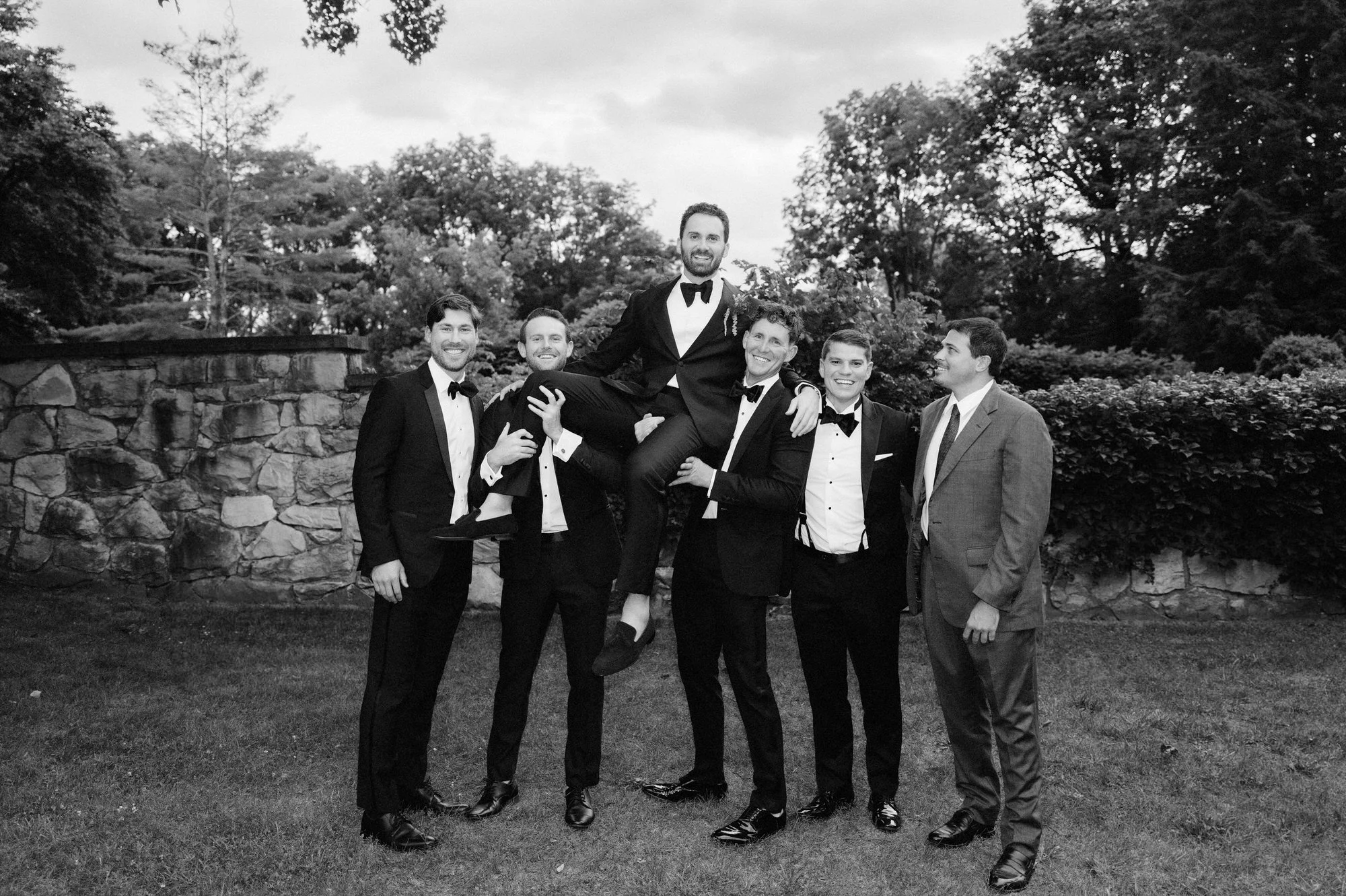 aa-0536-groom-lifted-by-groomsmen-troutbeck-amenia-ny-planned-by-ashley-douglass-jenny-fu.jpg