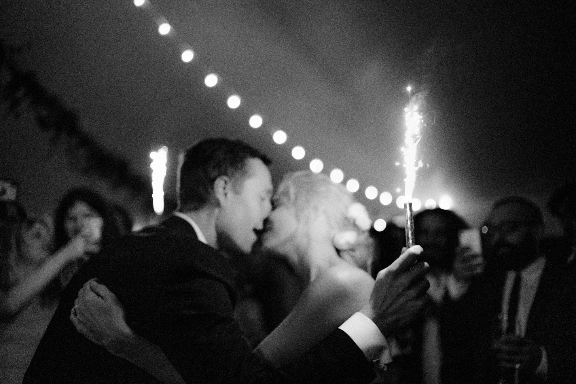 SJ-112-1-couple-celebrating-with-sparkler-kiss-under-tent-catskills-jenny-fu.jpg